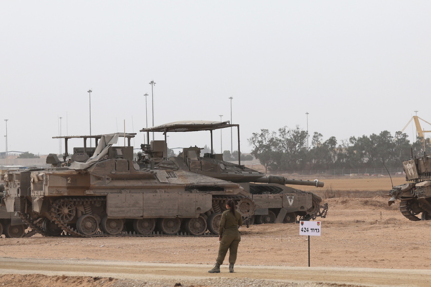 Israeli forces gather at the border with Gaza, southern Israel