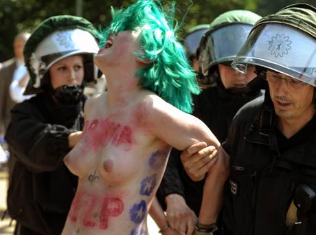 A Femen activist protests as US President Barack Obama visits Berlin