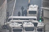 Security personnel blocking an entrance gate to protect impeached president Yoon Suk Yeol