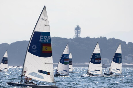 Vela Competitors in the Laser Radial Class, including Joel Rodriguez Perez of Spain (L) sail across