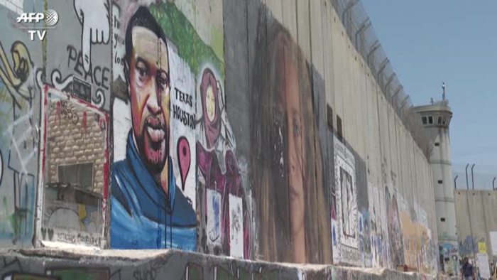 Bethlehem, the face of George Floyd on the wall that separates Israel ...