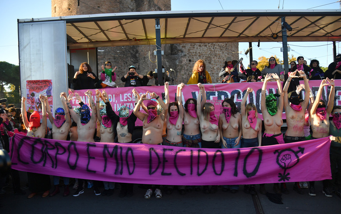 Activists strip off in demo against violence on women