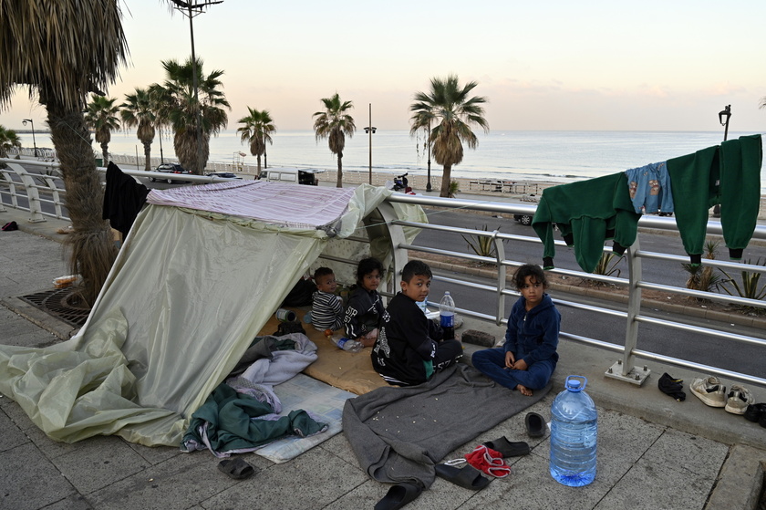 Displaced people seek shelter on Beirut's Ramlet al-Baida beach