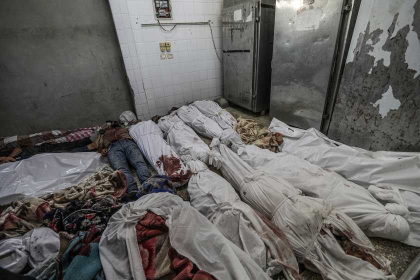 Palestinians mourn their dead following Israeli airstrikes on Gaza's Al Bureij refugee camp