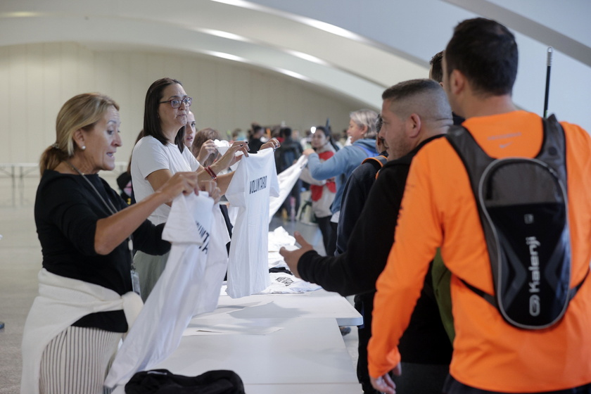 People volunteer to help people affected by flash floods in Valencia