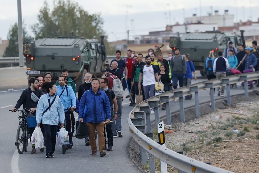 People volunteer to help people affected by flash floods in Valencia