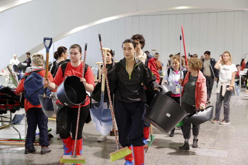 People volunteer to help people affected by flash floods in Valencia