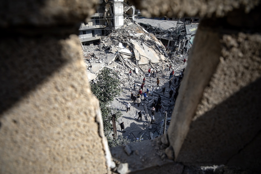 Palestinians inspect the area following Israeli airstrike on Rafah - RIPRODUZIONE RISERVATA