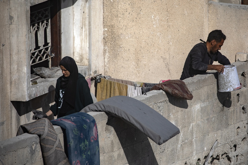 Palestinians inspect the area following Israeli airstrike on Rafah - RIPRODUZIONE RISERVATA