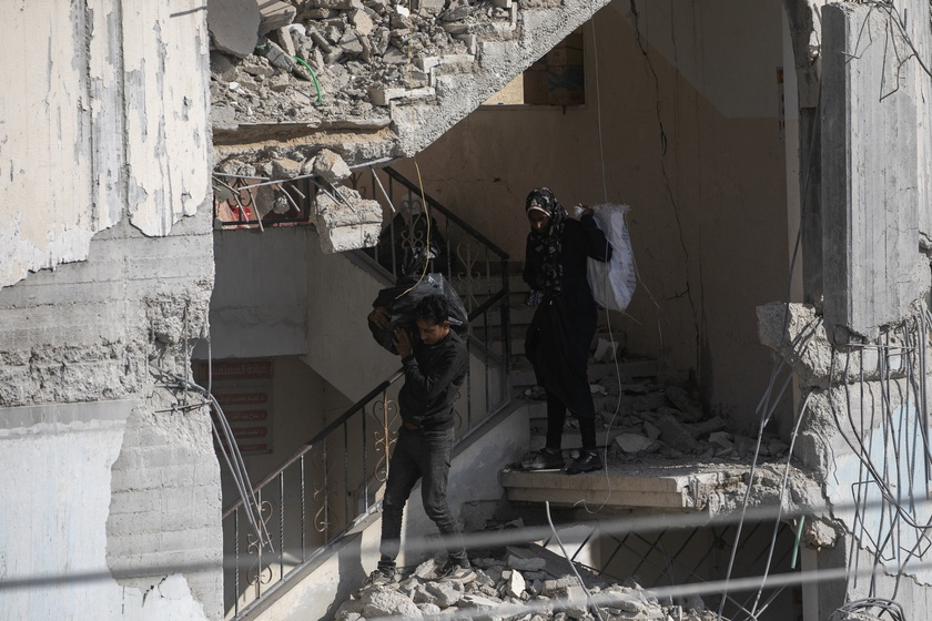 Palestinians inspect the area following Israeli airstrike on Rafah - RIPRODUZIONE RISERVATA