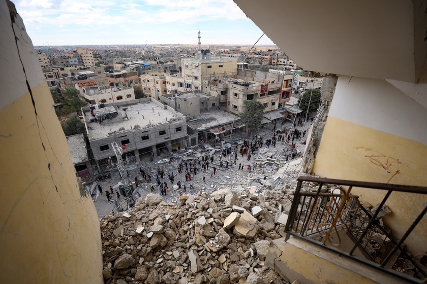 Palestinians inspect the area following Israeli airstrike on Rafah - RIPRODUZIONE RISERVATA