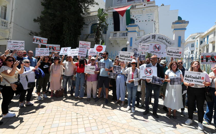 Journalists protest during a press freedom rally in Tunis