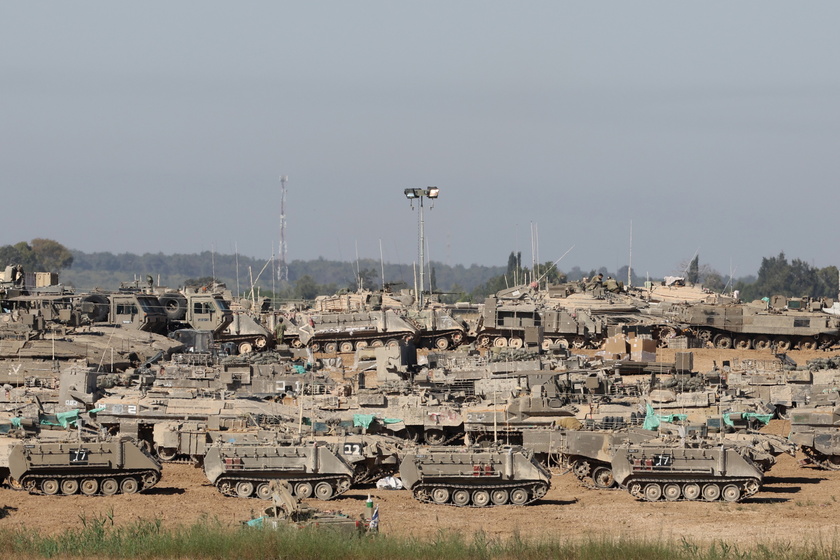 Israeli troops gather near the Gaza border, southern Israel