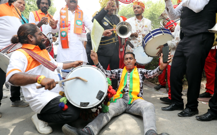 Bharatiya Janata Party supporters celebrate party lead in the election