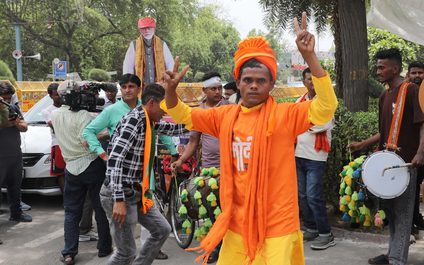 Bharatiya Janata Party supporters celebrate party lead in the election