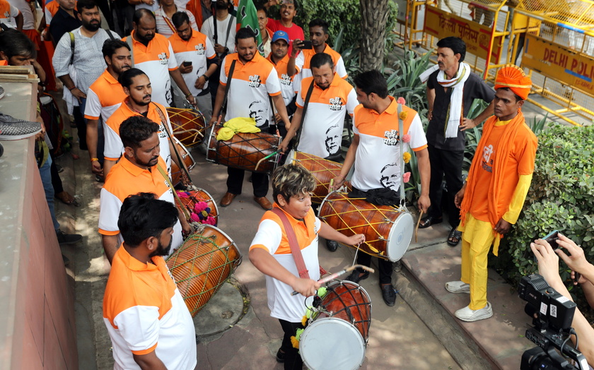 Bharatiya Janata Party supporters celebrate party lead in the election