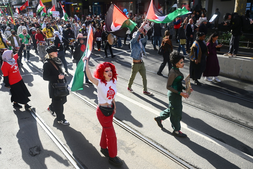 People hold a pro-Palestinian rally in Melbourne