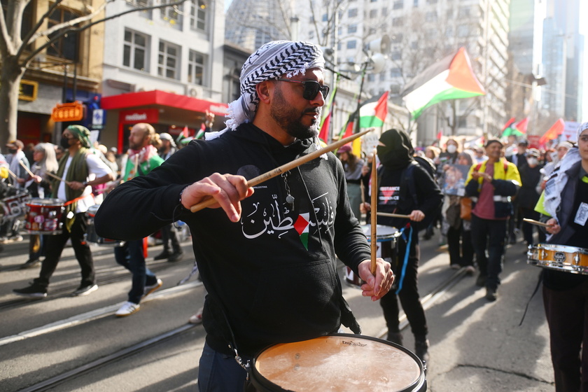 People hold a pro-Palestinian rally in Melbourne