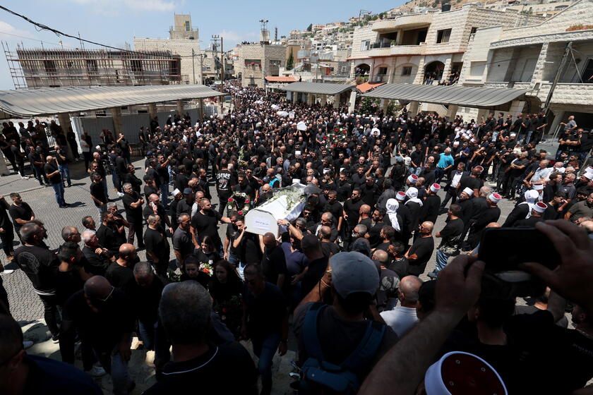 Relatives attend funeral of victims in Majdal Shams, after missile attack from Lebanon