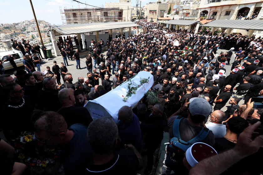 Relatives attend funeral of victims in Majdal Shams, after missile attack from Lebanon