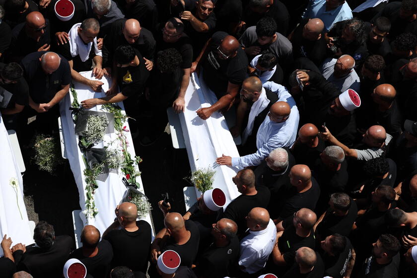 Relatives attend funeral of victims in Majdal Shams, after missile attack from Lebanon