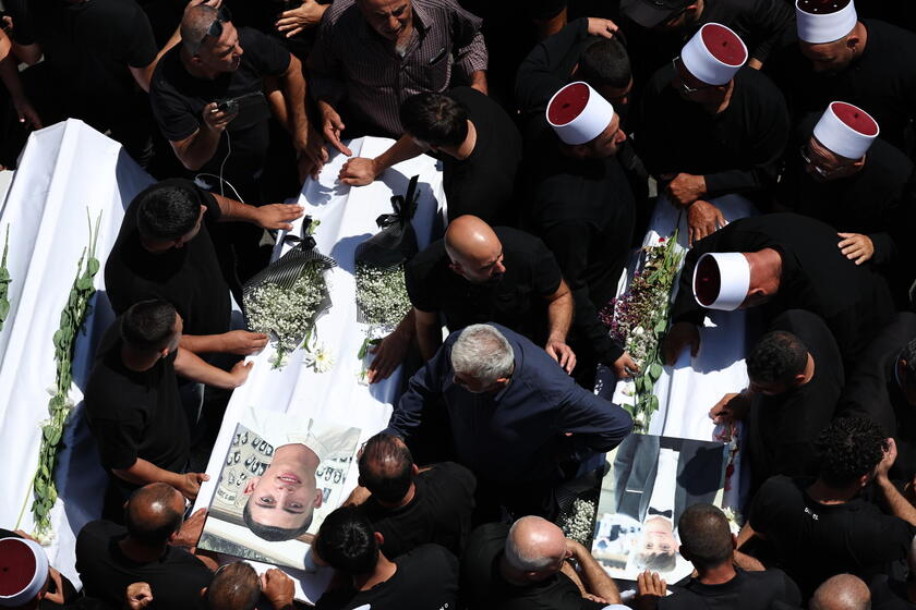 Relatives attend funeral of victims in Majdal Shams, after missile attack from Lebanon