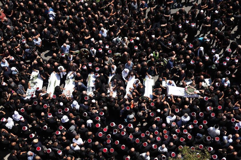 Relatives attend funeral of victims in Majdal Shams, after missile attack from Lebanon