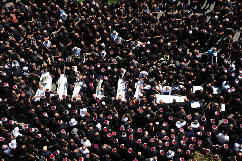 Relatives attend funeral of victims in Majdal Shams, after missile attack from Lebanon