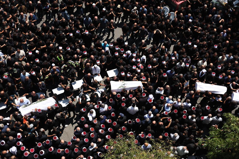 Relatives attend funeral of victims in Majdal Shams, after missile attack from Lebanon