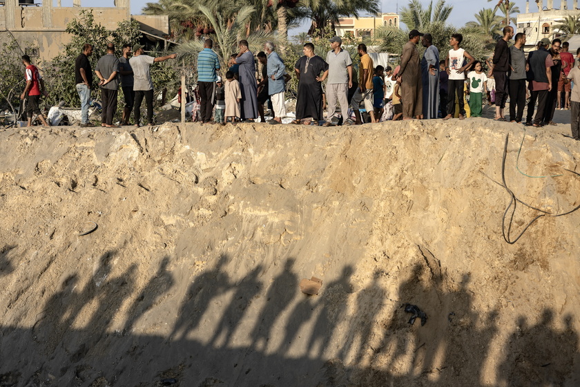 Palestinians search for missing people following Israeli airstrikes on Al-Mawasi humanitarian zone