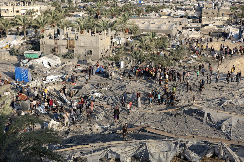 Palestinians search for missing people following Israeli airstrikes on Al-Mawasi humanitarian zone