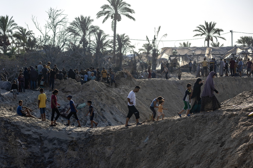 Palestinians search for missing people following Israeli airstrikes on Al-Mawasi humanitarian zone