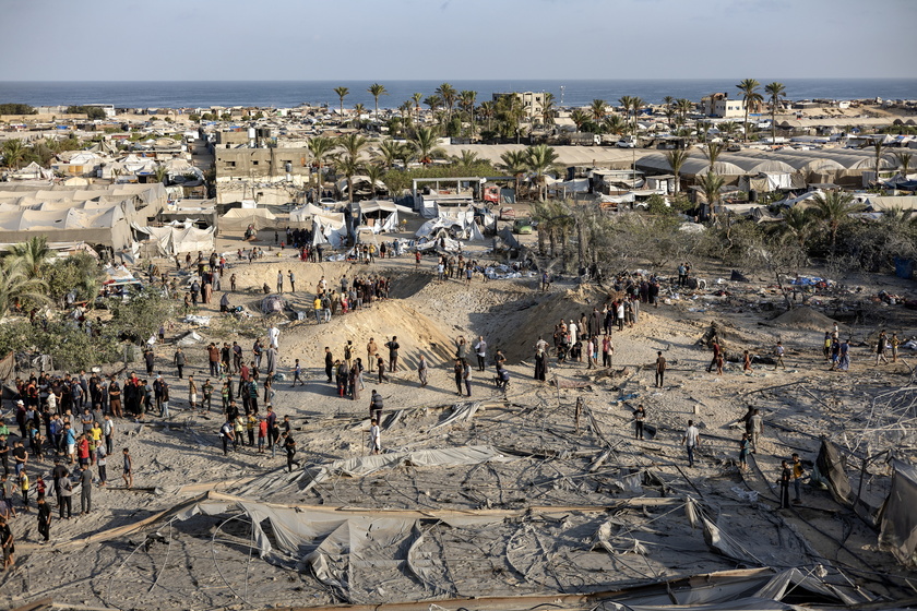 Palestinians search for missing people following Israeli airstrikes on Al-Mawasi humanitarian zone