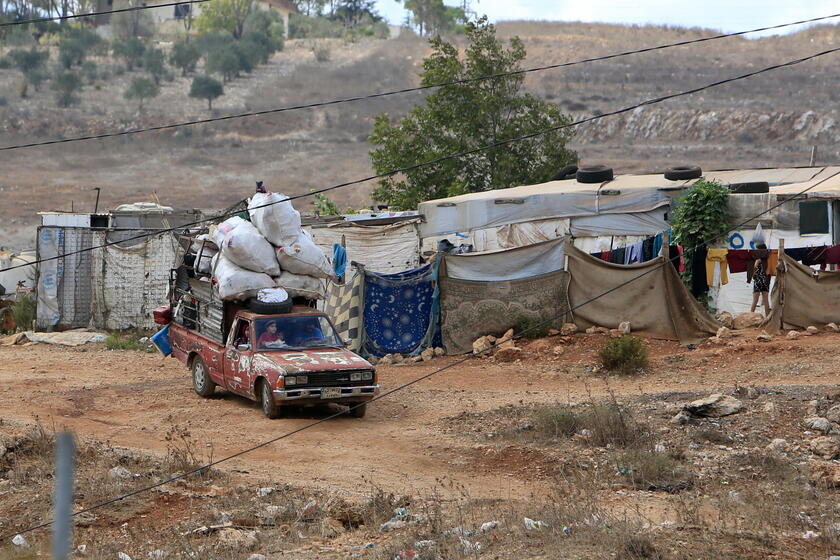 Residents leave southern Lebanon's Wazzani village after evacuation leaflets dropped over