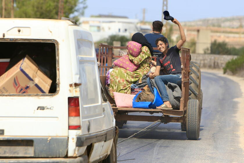 Residents leave southern Lebanon's Wazzani village after evacuation leaflets dropped over