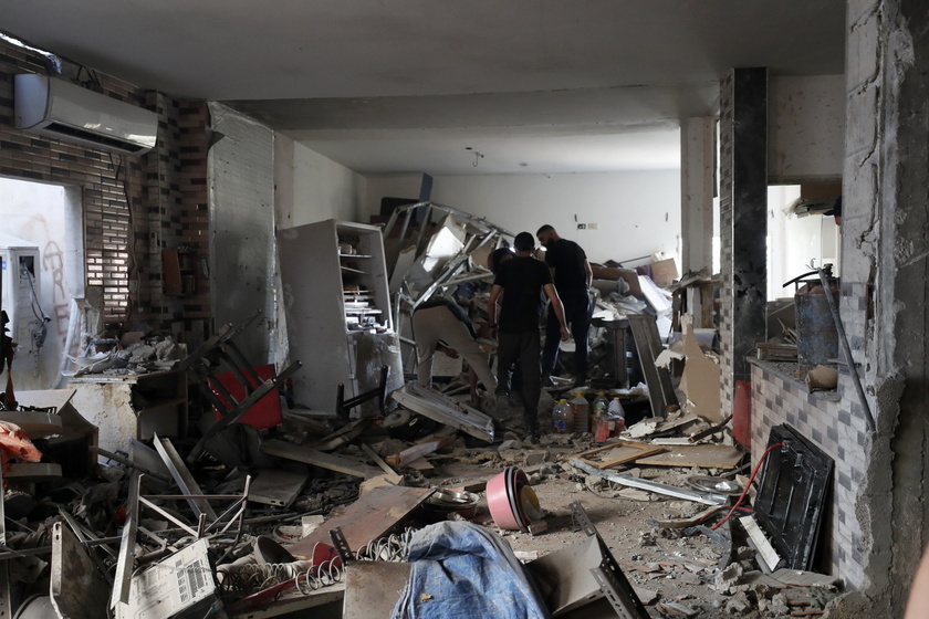 Palestinians inspect the damage after 9-day Israeli military operation in West Bank's Jenin