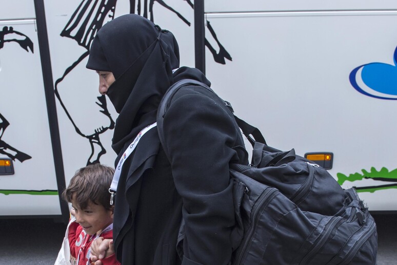 Migranti a Berlino © ANSA/AP